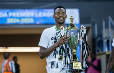 APR FC captain Claude Niyomugabo holds the League trophy at Amahoro stadium on May 28, 2025. He  is reportedly attracting interest from Tanzanian Premier League side Azam FC. Olivier Mugwiza